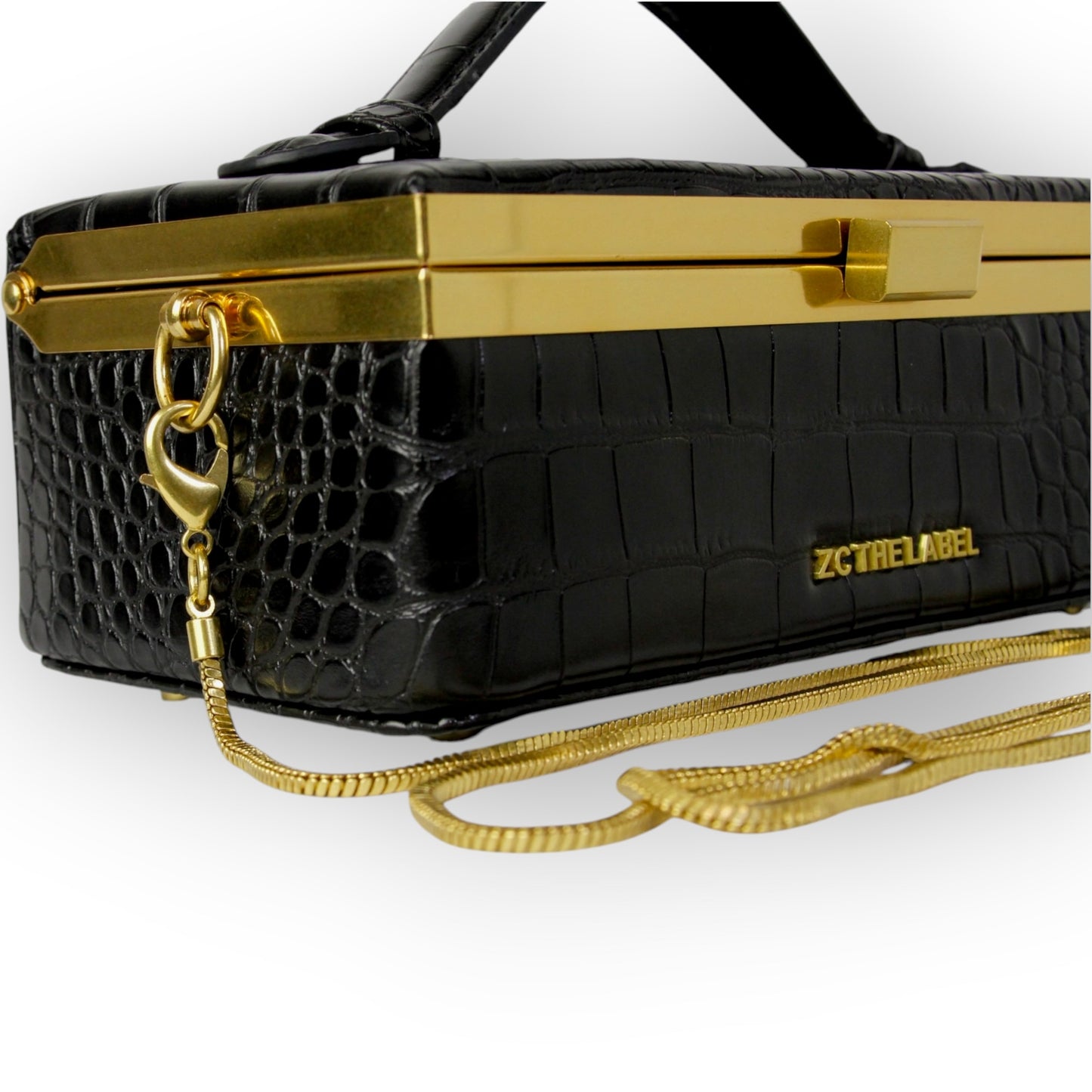 Zuri top handle mini bag with gold clasp in Matte Black Croc