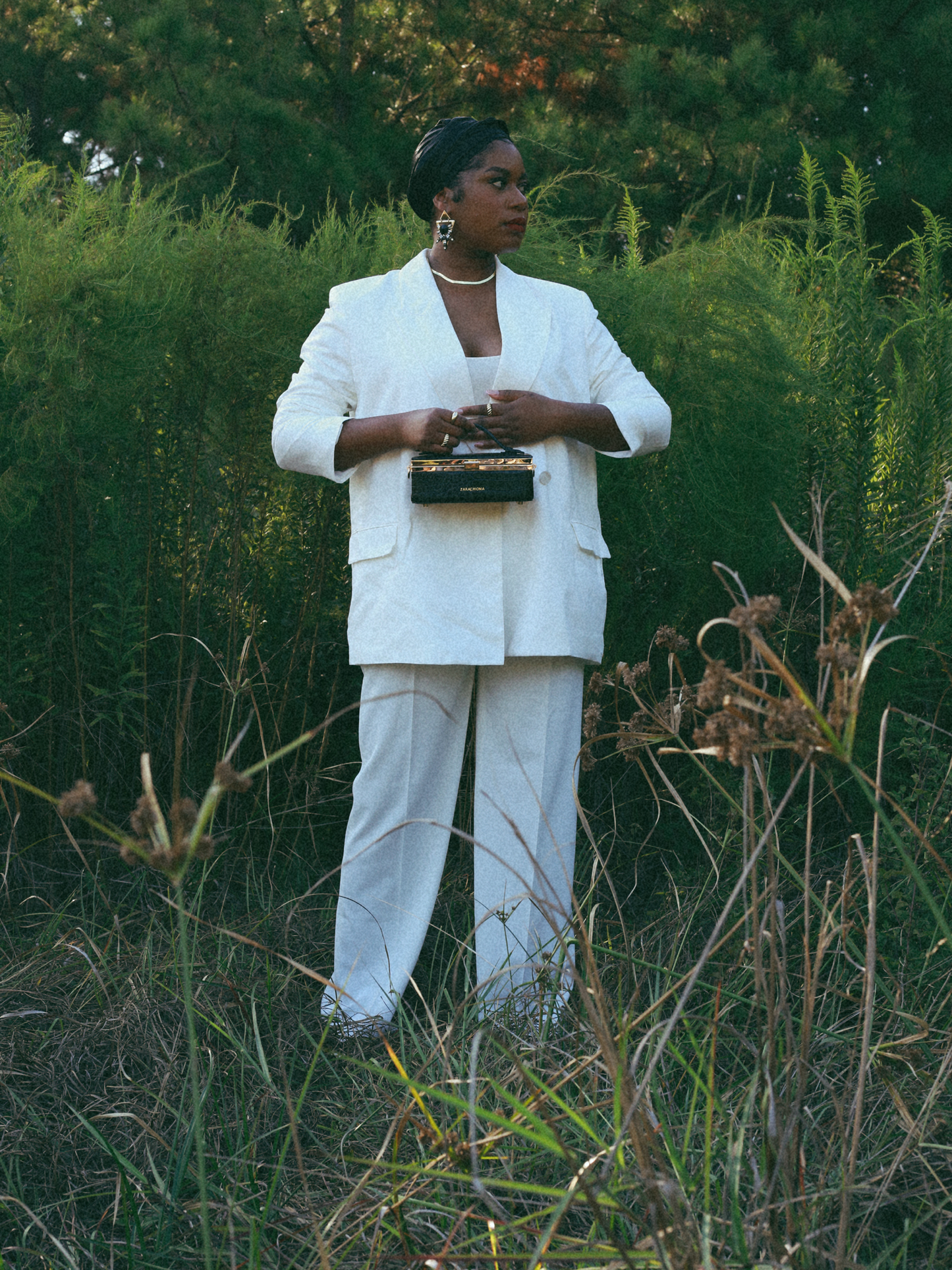 Zuri top handle mini bag with gold clasp in Matte Black Croc